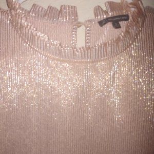 Metallic pink ruffled sleeveless shirt